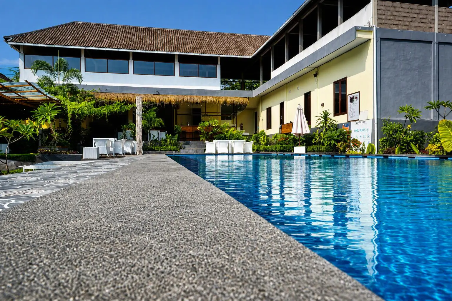 Pool and resort building viewed from water level
