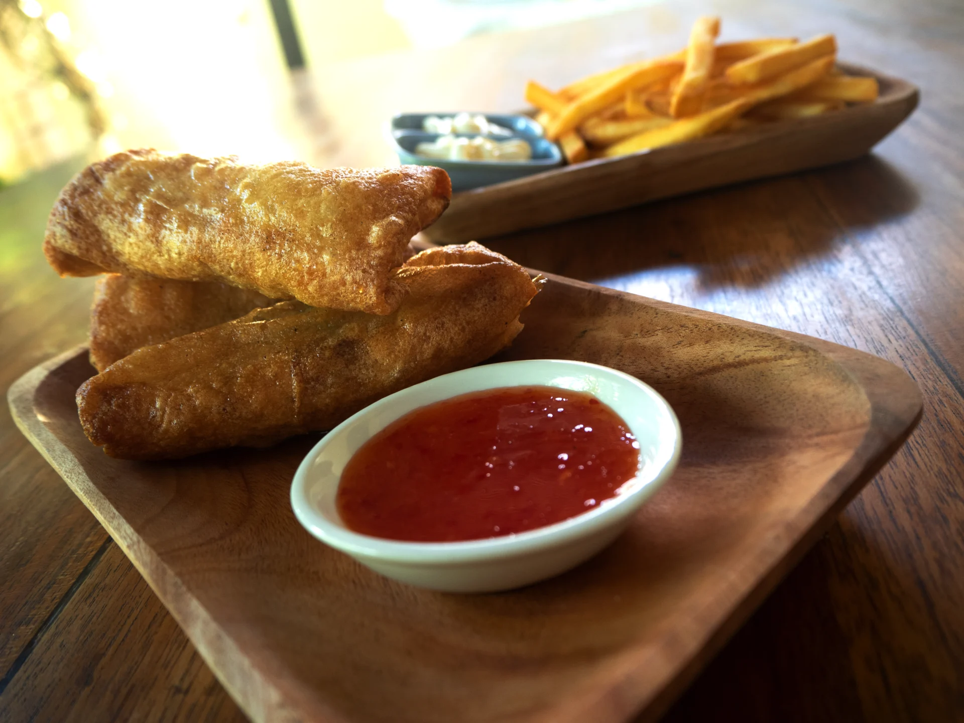 A sharing plate with crispy bites and fries