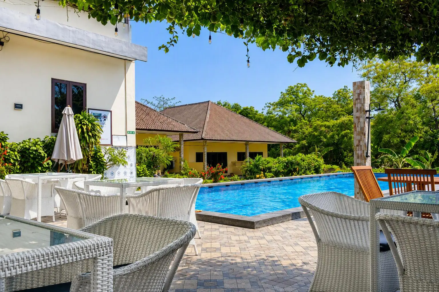 Terrace with chairs beside the pool