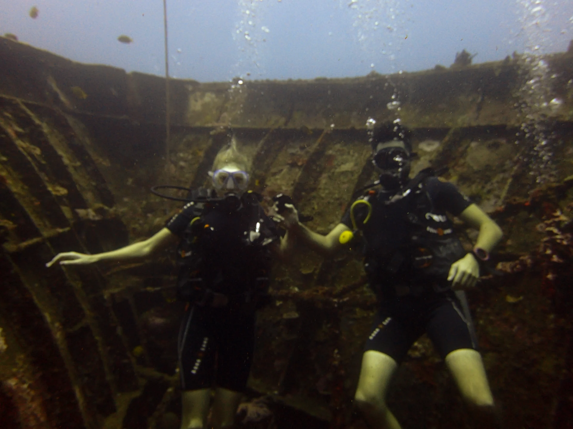 Two divers in an open area in Kubu, Bali