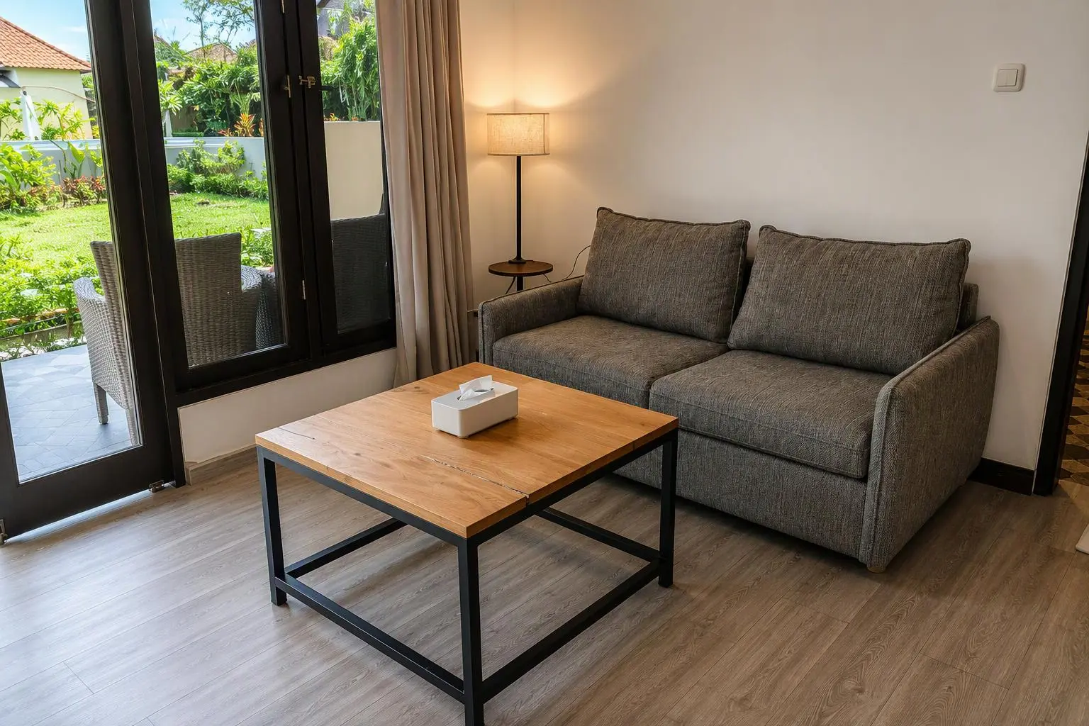 Sofa and coffee table beside the terrace