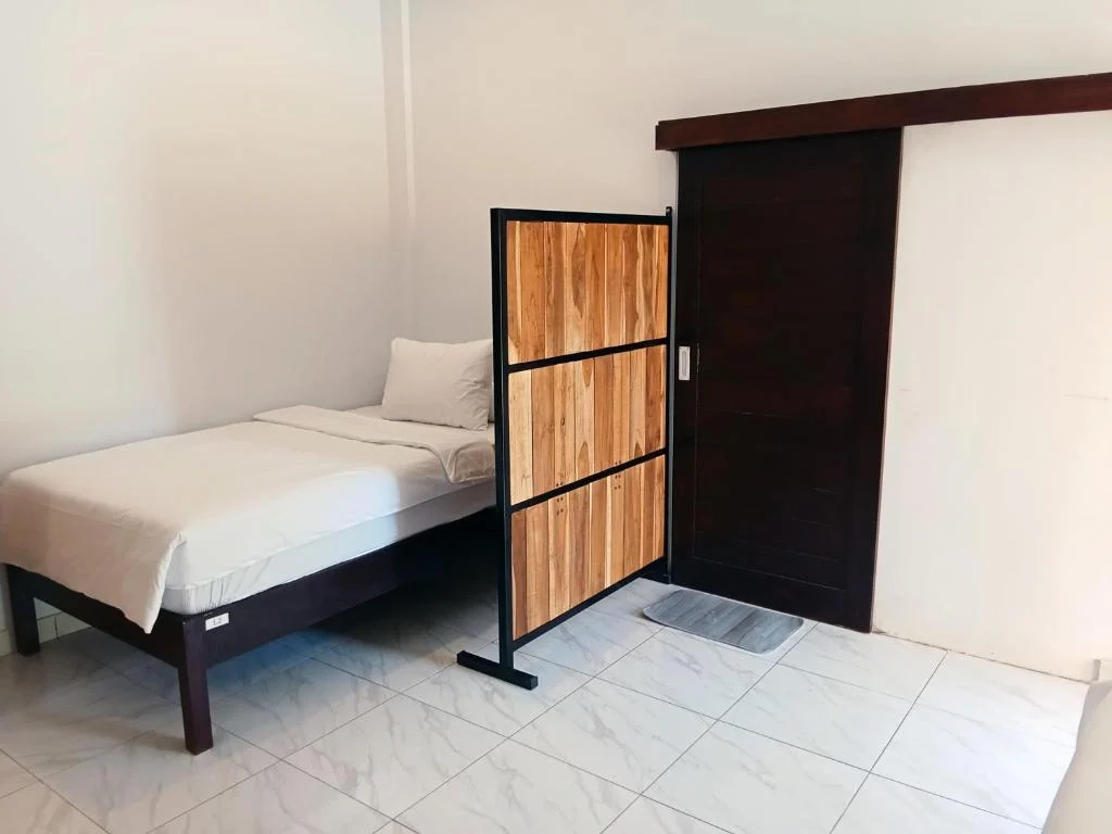 Dormitory bed with privacy divider