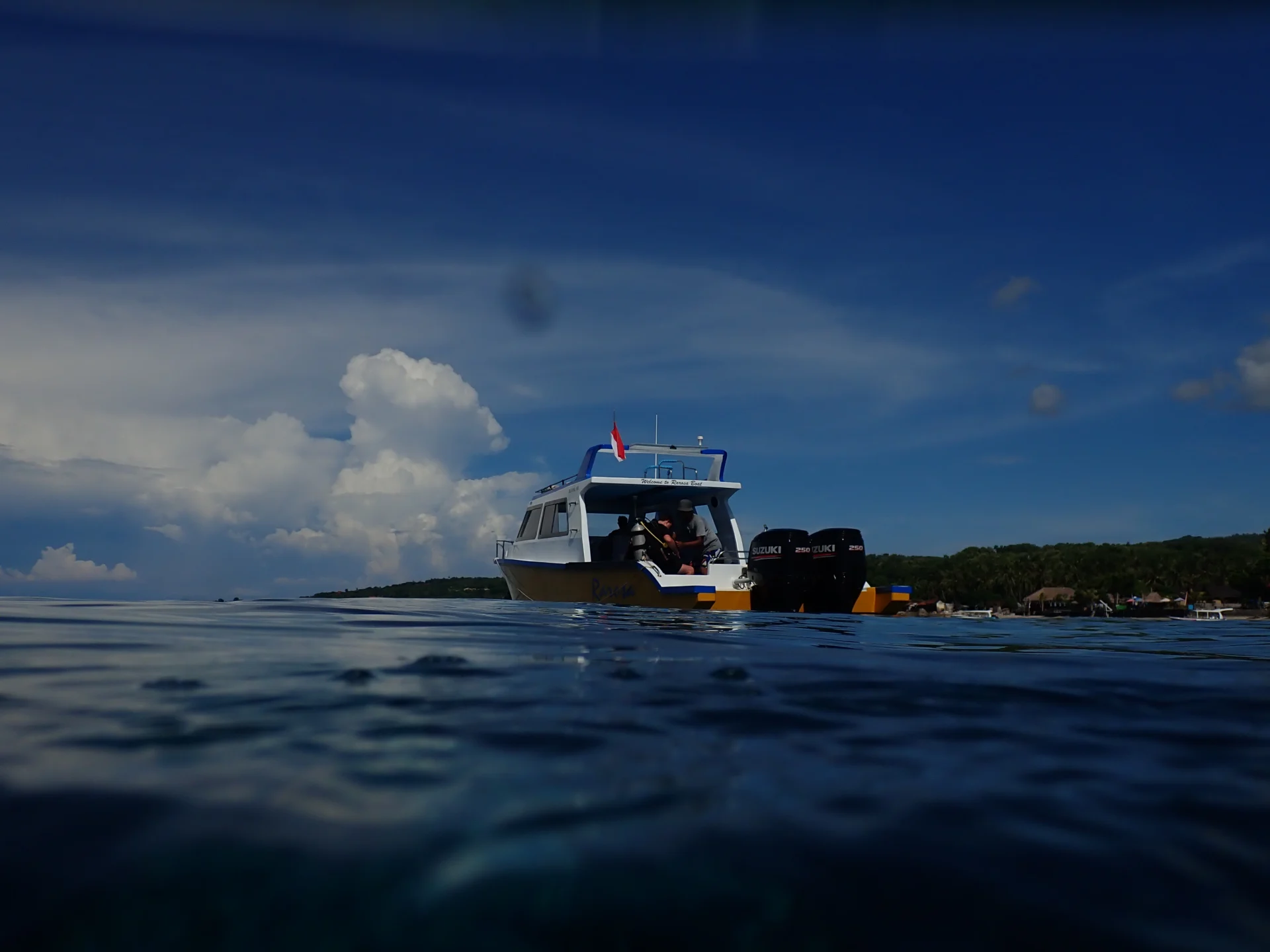 Dive boat viewed from the water surface