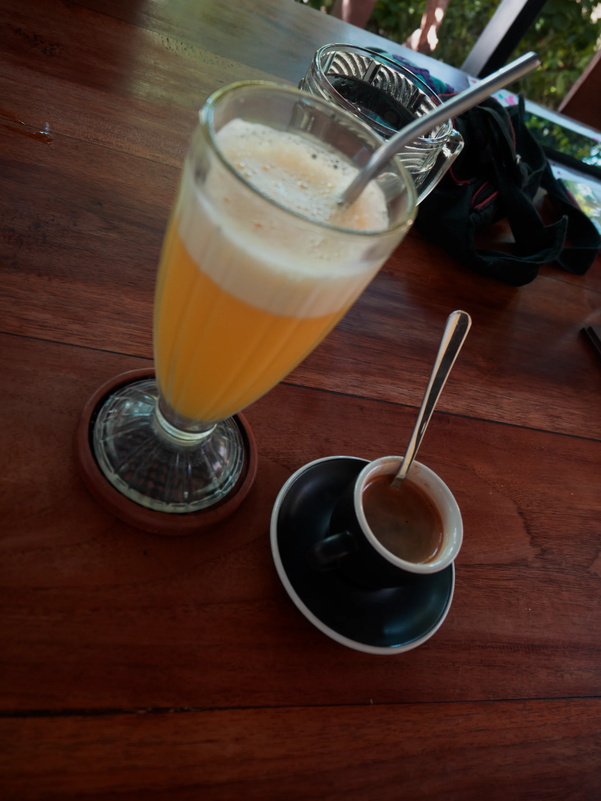 A fresh drink and coffee served on a table at The Tribe