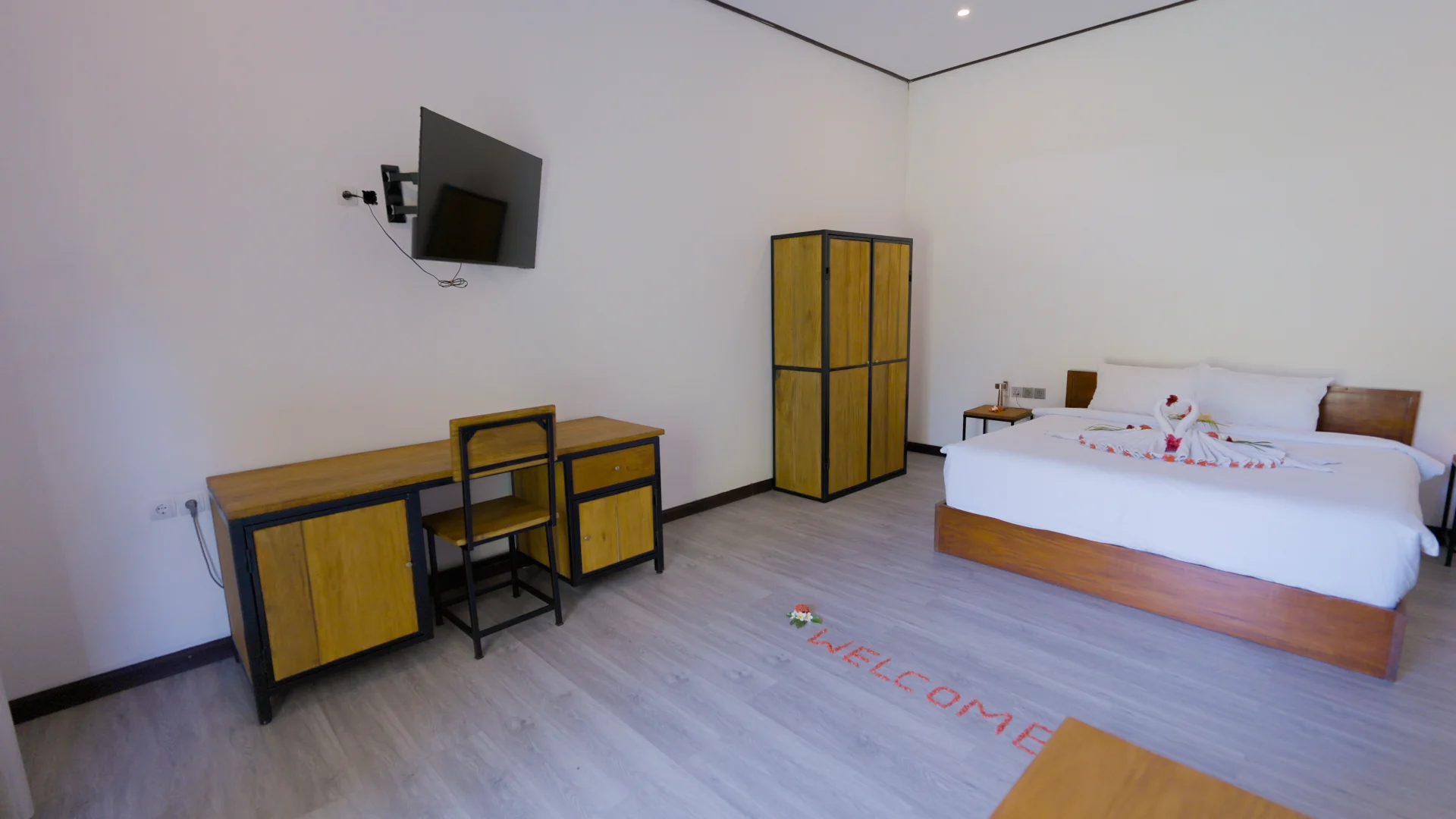 Another angle of the Poolview Deluxe room and its desk area