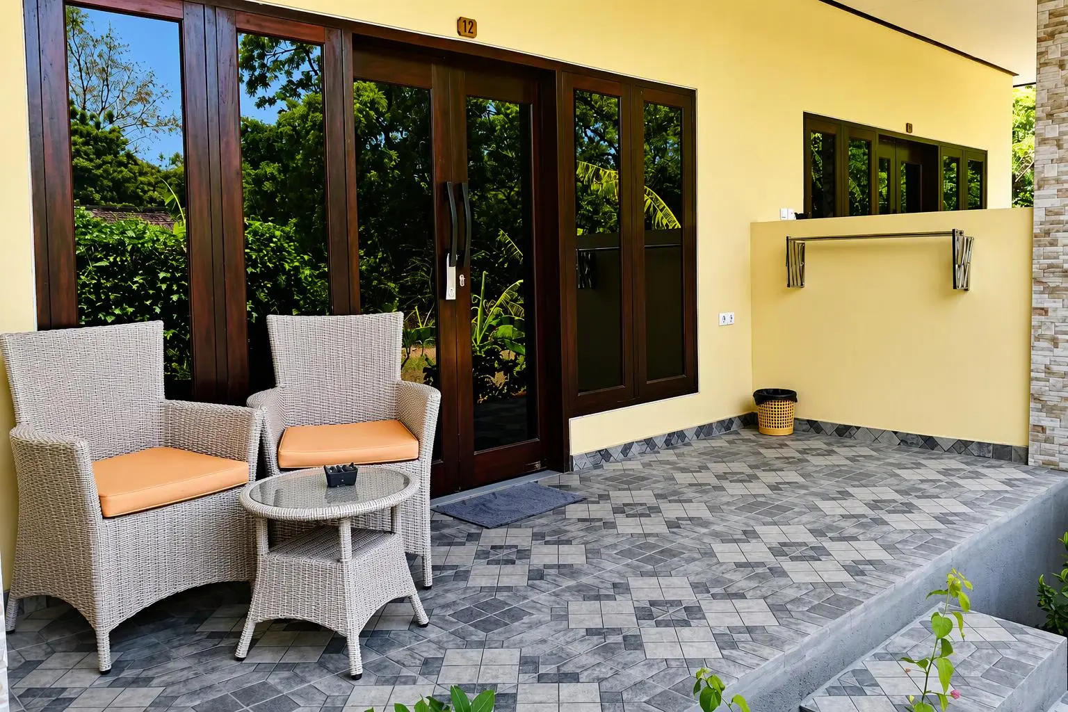 Junior Suite terrace with two armchairs and a table