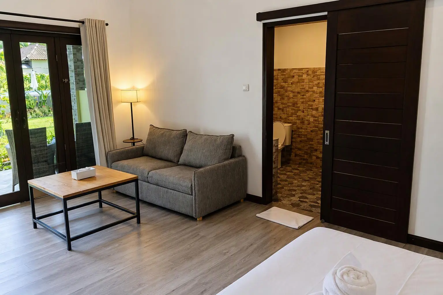Junior Suite seating area and bathroom entrance