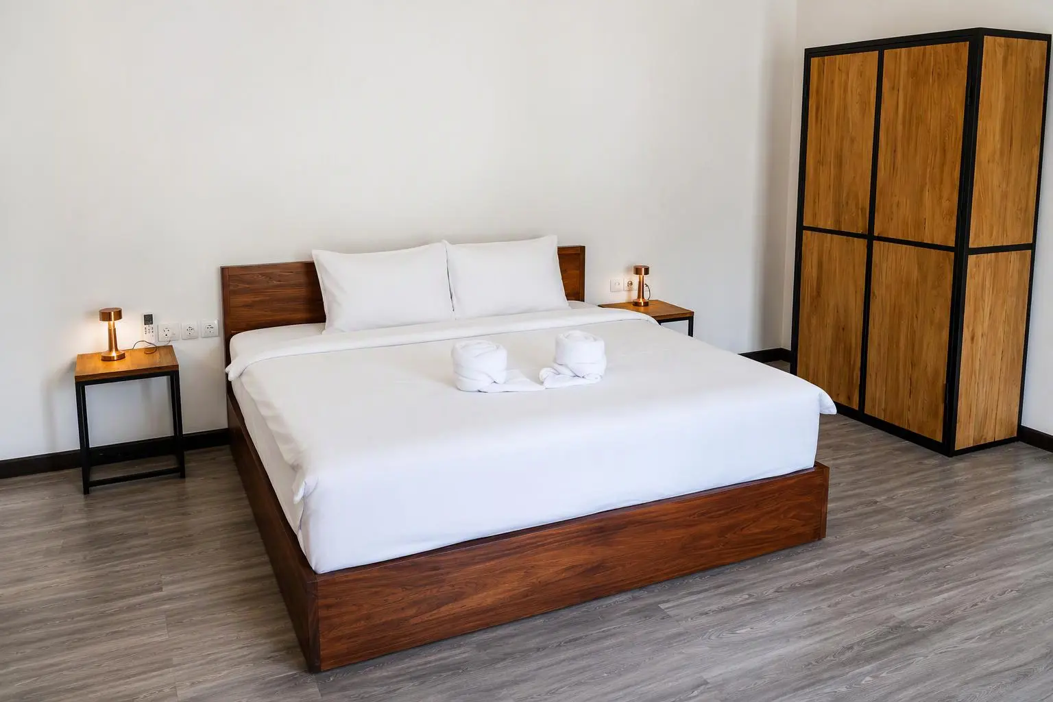 Double bed and wardrobe in the Junior Suite