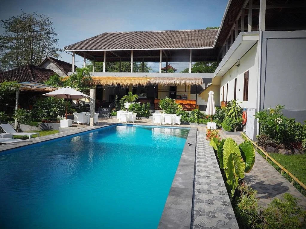 Pool and tropical garden at Scuba Tribe Bali resort